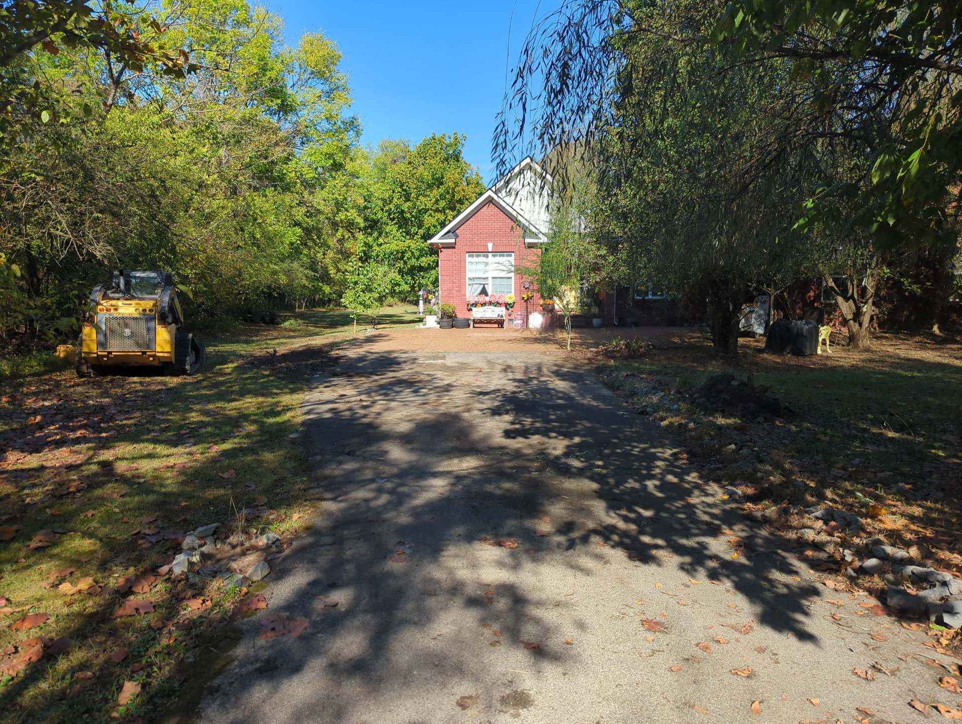 Original asphalt driveway before the raised stormwater-diversion driveway was built