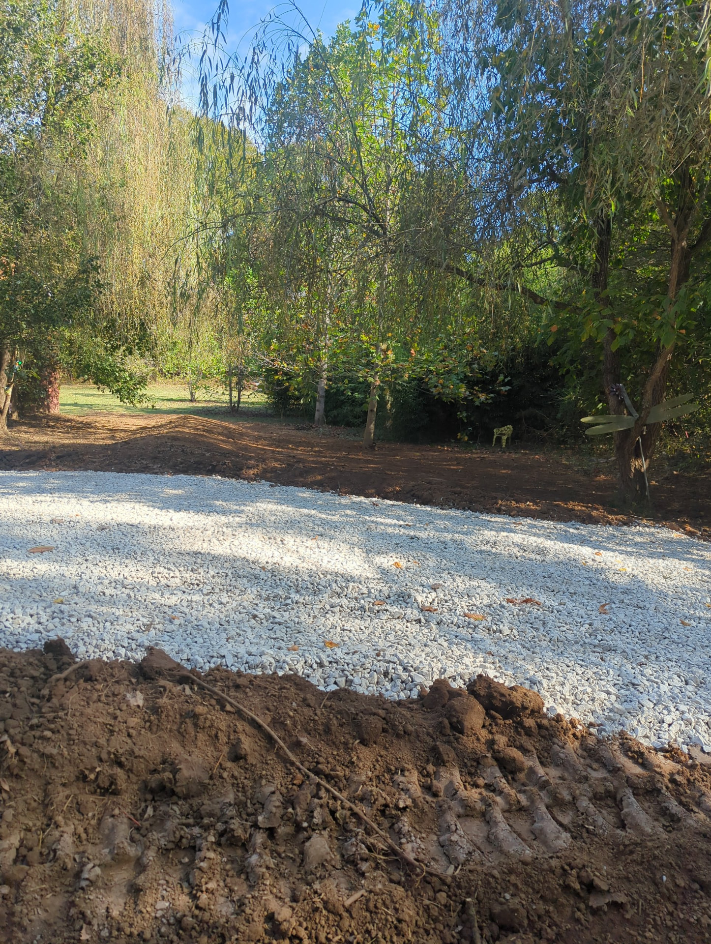 High point of the raised driveway continuing directly into the earthen berm