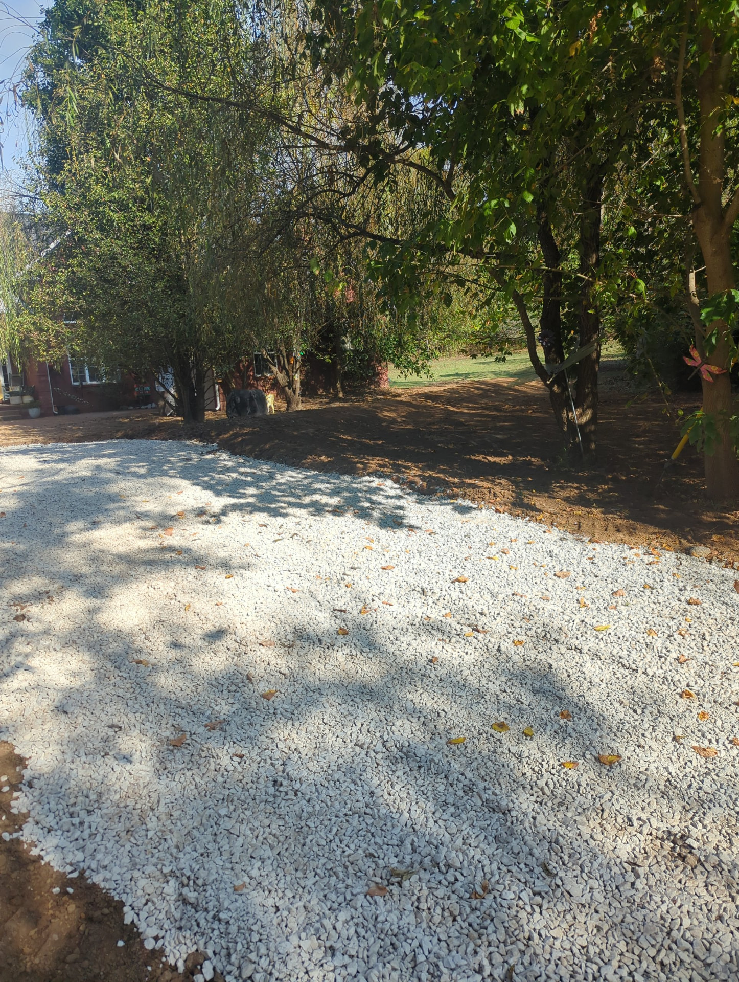 Long #57 stone driveway profile built as a gentle vertical transition