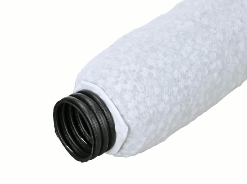 Premanufactured French drain product — perforated pipe wrapped in a fabric sock filled with lightweight synthetic aggregate