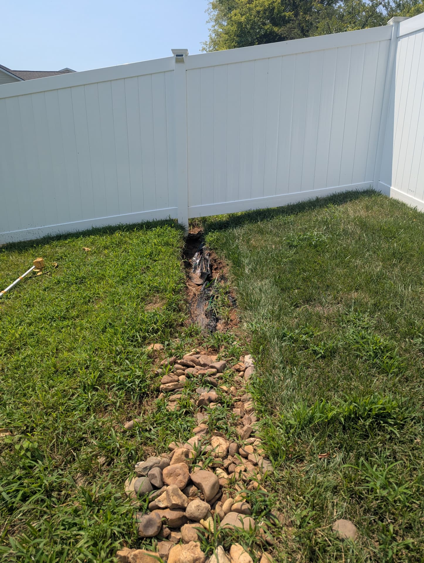 Erosion channel caused by concentrated stormwater runoff entering a backyard in Columbia Tennessee