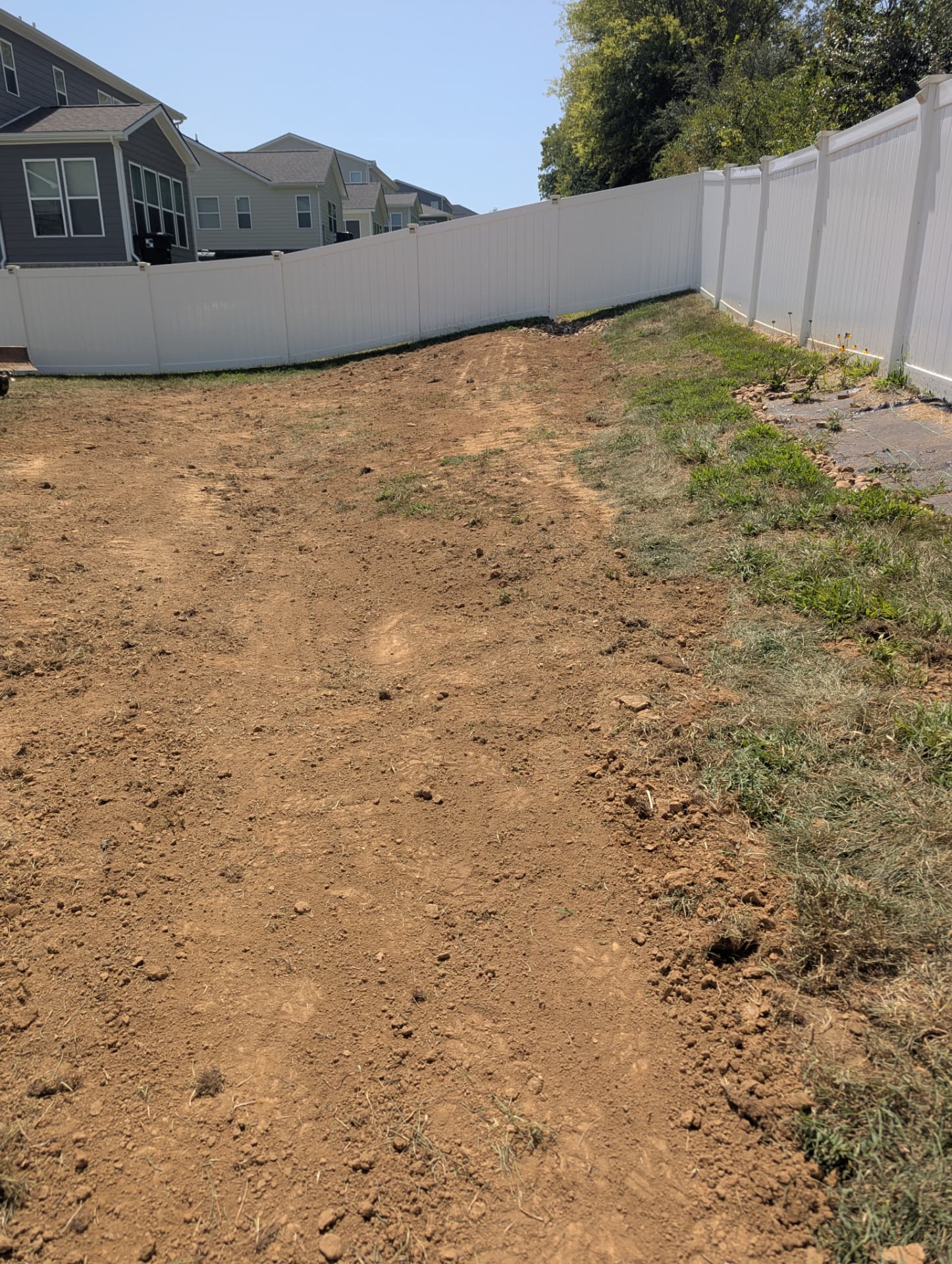 Residential backyard regraded for positive drainage in Columbia Tennessee