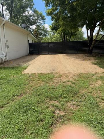 Finished backyard grading and drainage project with seed and straw blanket in Williamson County, TN