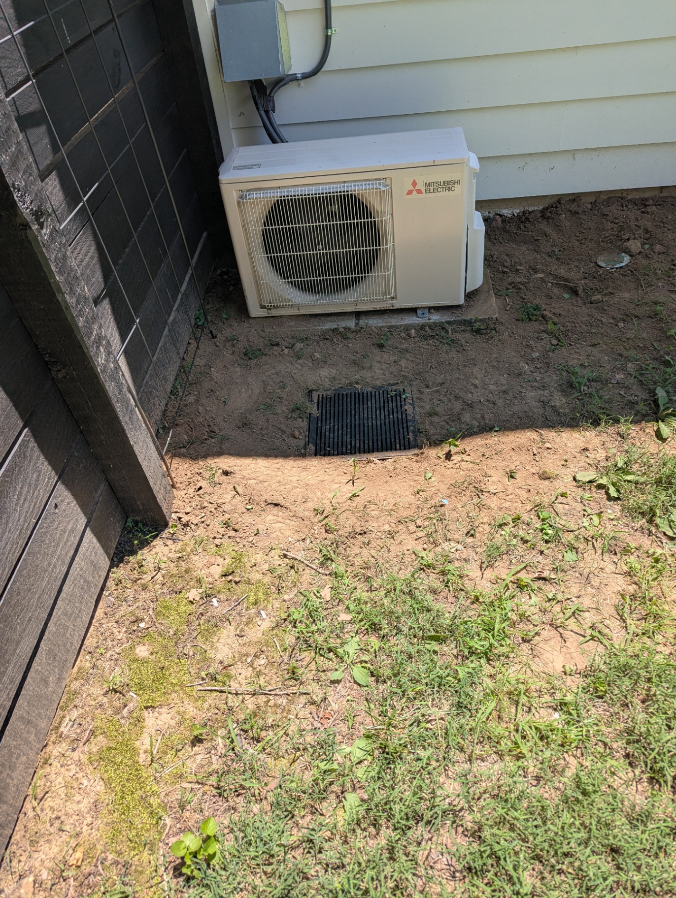 Yard drain installed in a low area to capture residual surface water at a Williamson County, TN home